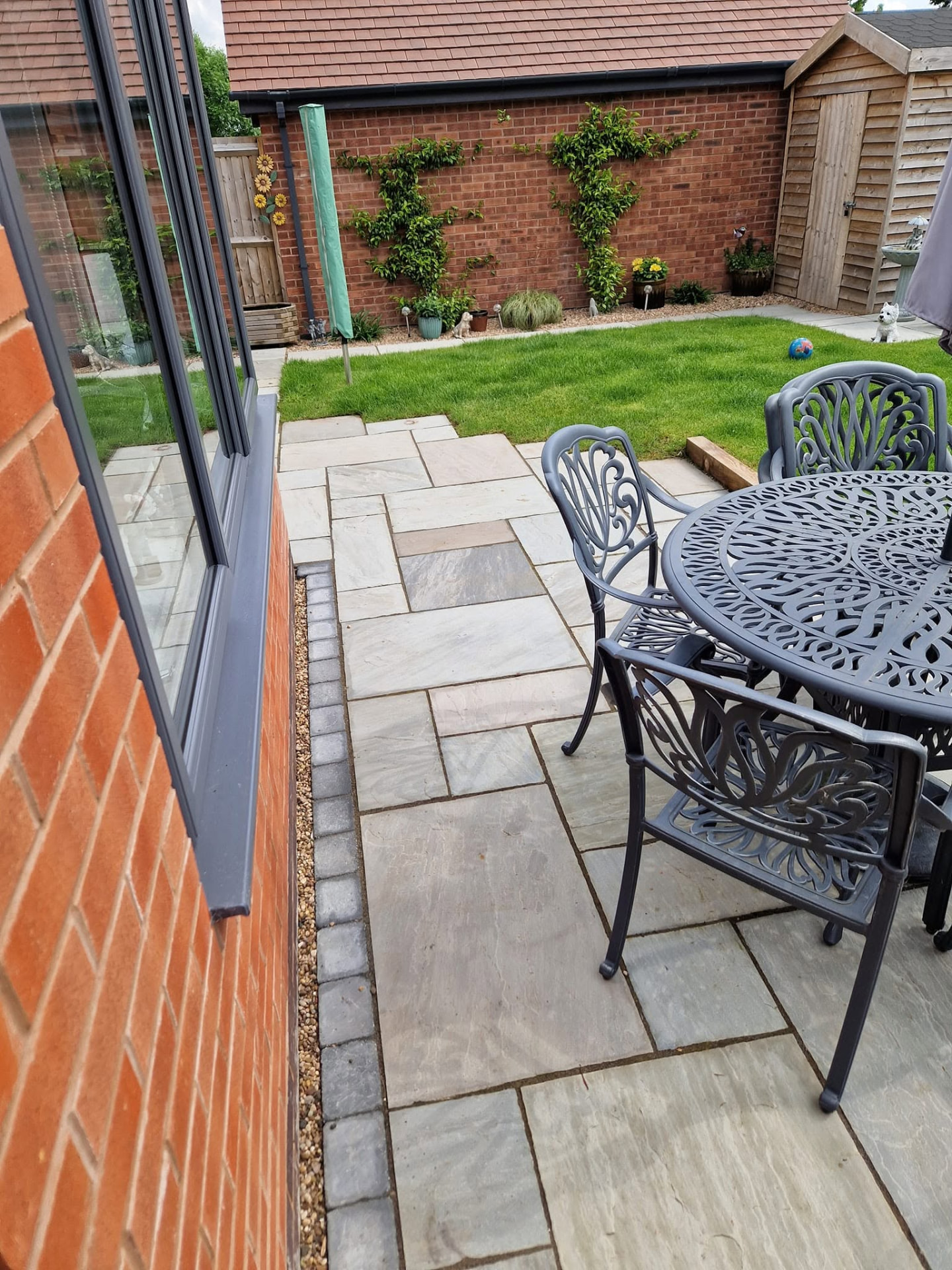 Restored sandstone patio after professional patio cleaning and rejointing in Redditch, Worcestershire