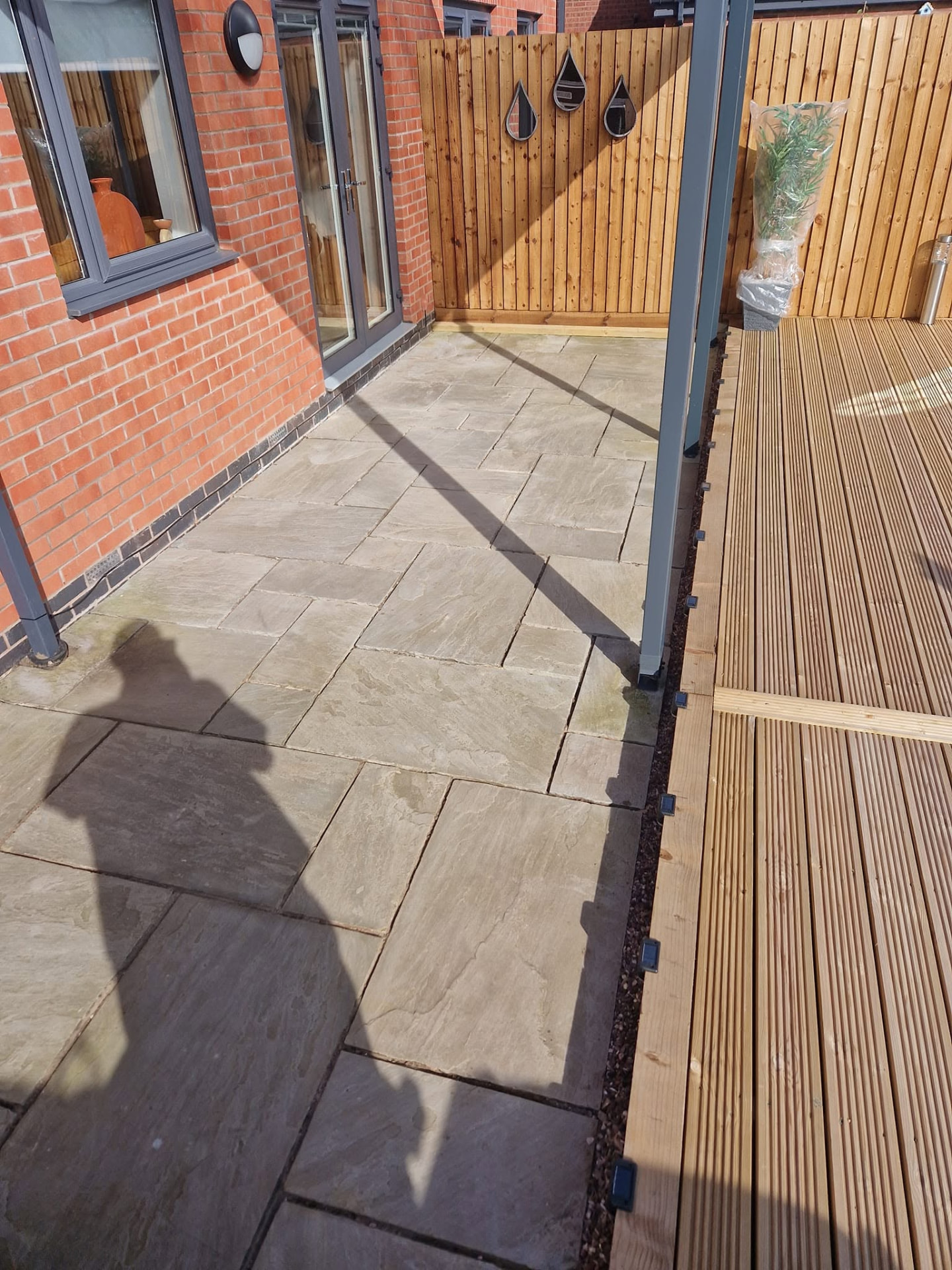 Restored sandstone patio after professional patio cleaning and rejointing in Redditch, Worcestershire